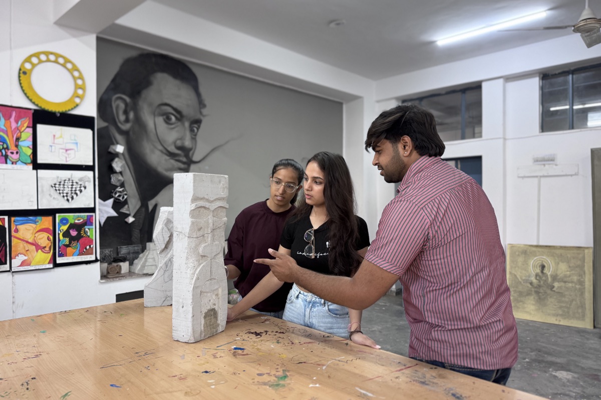 Students discussing sculpture in art studio at CODE, VGU Jaipur